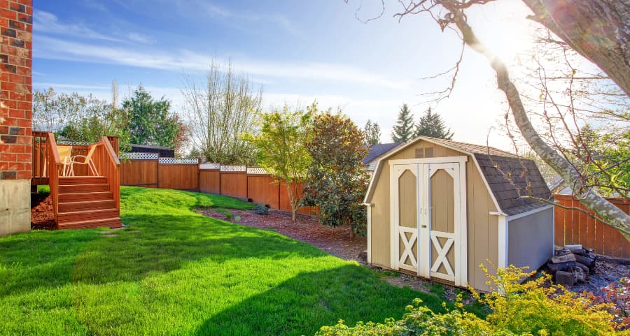 Fenced backyard with storage shed in Charleston