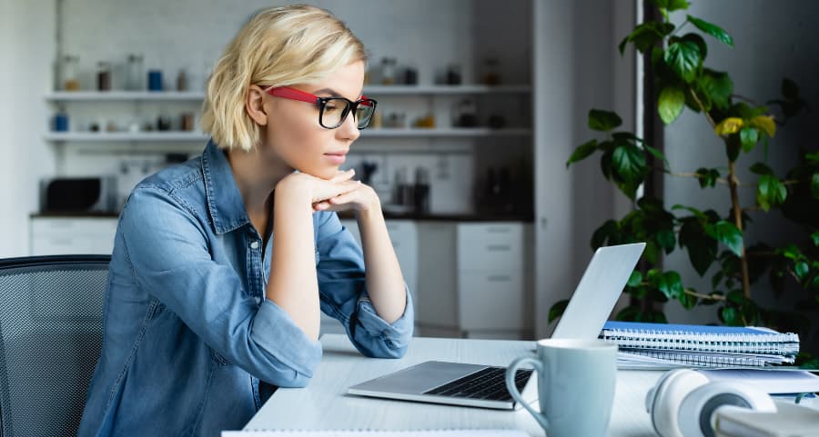 Young professional using computer in home office